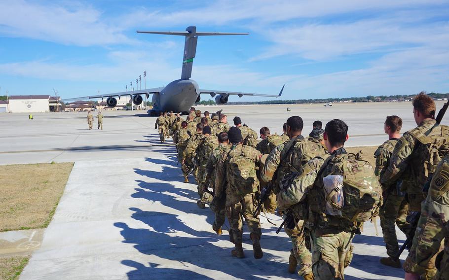 Soldiers with the Fort Bragg, N.C.-based 2nd Battalion, 504th Parachute Infantry Regiment, 1st Brigade Combat Team board a C17 Globemaster aircraft on Jan. 1, 2020.