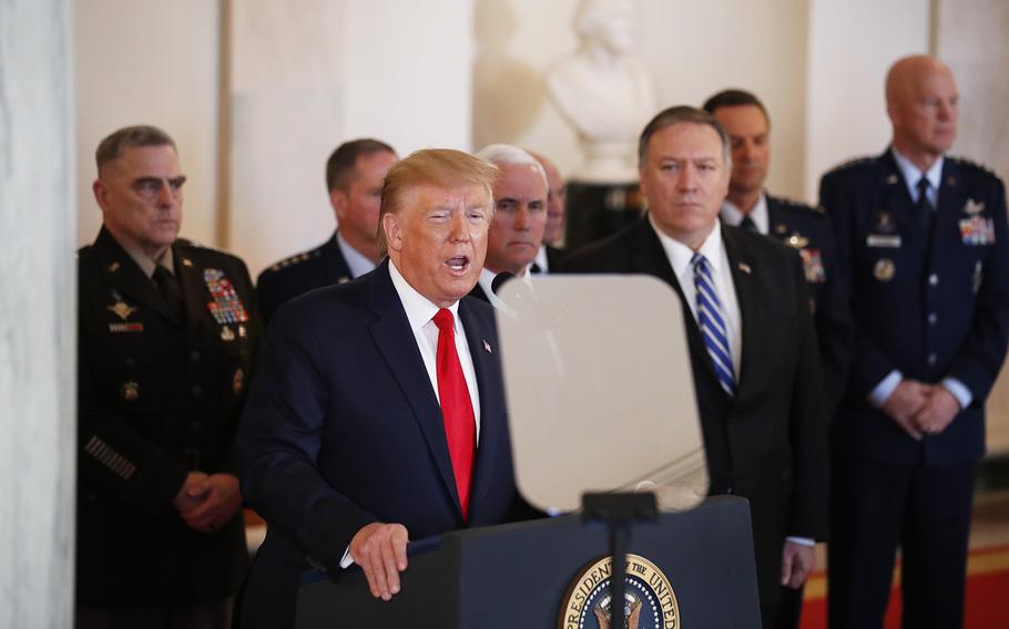 President Donald Trump addresses the nation from the White House on the ballistic missile strike that Iran launched against Iraqi air bases housing U.S. troops, Wednesday, Jan. 8, 2020, in Washington, as Vice President Mike Pence, Secretary of State Mike Pompeo and military leaders, looks on. 