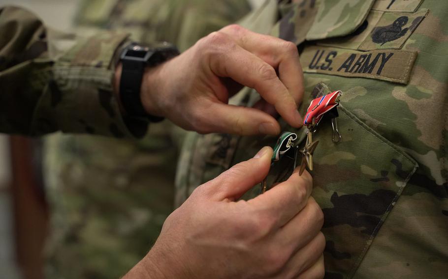 Two valor awards are pinned to the uniform of a 2nd Battalion, 7th Special Forces Group (Airborne) soldier during a ceremony in the chapel at Eglin Air Force Base, Fla., on Thursday, Jan. 9, 2019, where dozens of the units members were recognized for their heroism and sacrifice during a recent six-month deployment to Afghanistan.

Jose Vargas/U.S. Army