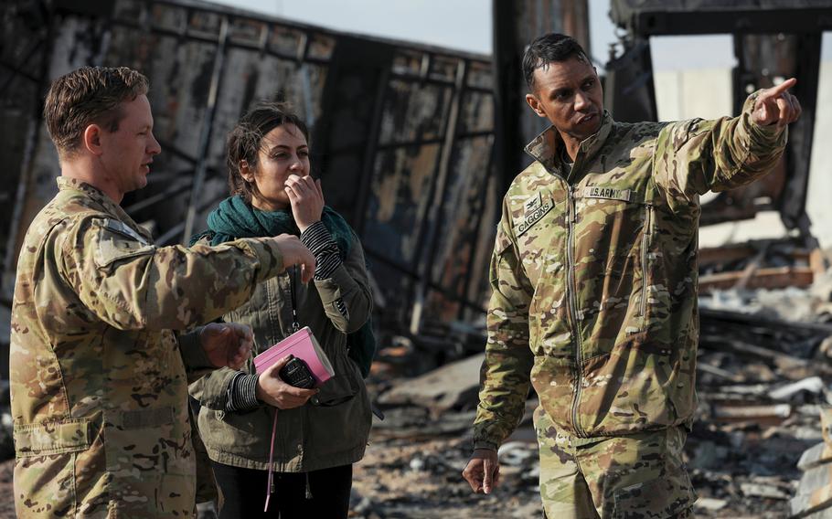 U.S. Army Col. Myles B. Caggins III, Combined Joint Task Force - Operation Inherent Resolve military spokesperson, right, answers interview questions at Al Asad Air Base, Iraq, Jan. 13, 2020. Multiple international news agencies were invited by military officials to participate in a media event at Al Asad due to the recent ballistic missile attacks.