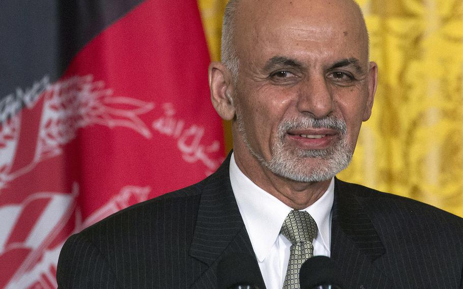 President Ashraf Ghani of Afghanistan stands in front of his nation's flag during a news conference at the White House in 2015. 
