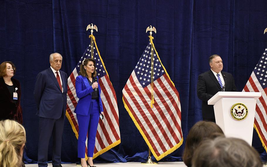 Secretary of State Mike Pompeo, right, takes questions from reporters while on stage with Zalmay Khalilzad, second from left, the U.S. special envoy for Afghan reconciliation, after a historic peace deal between the U.S. and the Taliban was signed Saturday,  Feb. 29, 2020, in Doha, Qatar. 