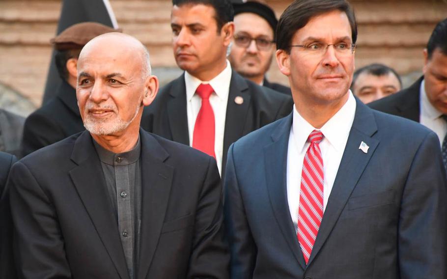 Afghan President Ashraf Ghani, left, and U.S. Defense Secretary Mark Esper attend a ceremony in Kabul on Saturday, Feb. 29, 2020, during which they said U.S. and NATO forces would remain committed to assisting Afghanistan as the country attempts to achieve peace. 