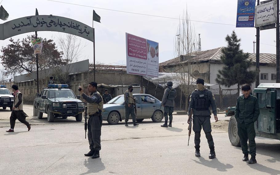 Afghan security personnel arrive at the site of an attack in Kabul, Afghanistan, Friday, March 6, 2020.  Gunmen in Afghanistan's capital of Kabul attacked a remembrance ceremony for a minority Shiite leader on Friday, wounding a dozen of people, officials said. 