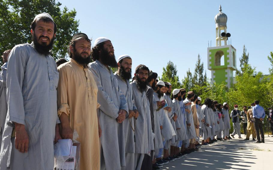 Taliban prisoners line up at Bagram prison before being released on Tuesday, May 26, 2020. The Afghan government is set to release up to 5,000 prisoners as outlined in a U.S.-Taliban deal signed in February. 