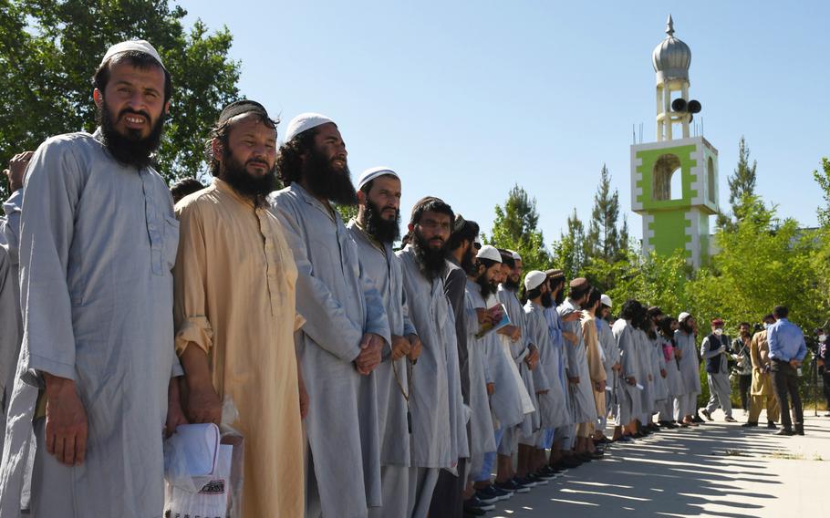 Taliban prisoners line up at Bagram prison before being released on Tuesday, May 26, 2020. The Afghan government is set to release up to 5,000 prisoners as outlined in a U.S.-Taliban deal signed in February.