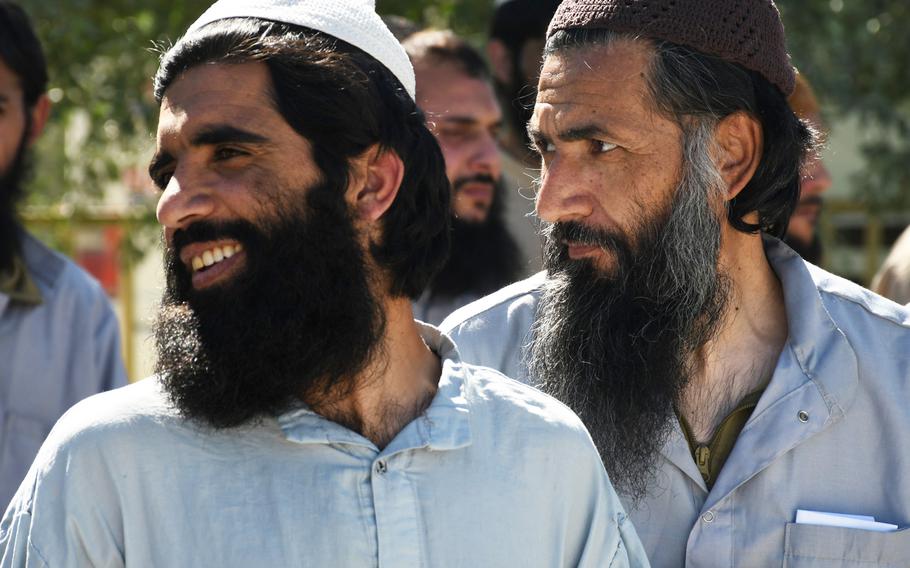 Two Taliban inmates at Bagram prison wait to be freed on Tuesday, May 26, 2020. Roughly 900 Taliban prisoners were released across the country by the Afghan government Tuesday, adhering to a U.S.-Taliban peace deal signed in February, which calls for up to 5,000 inmates to be released.  