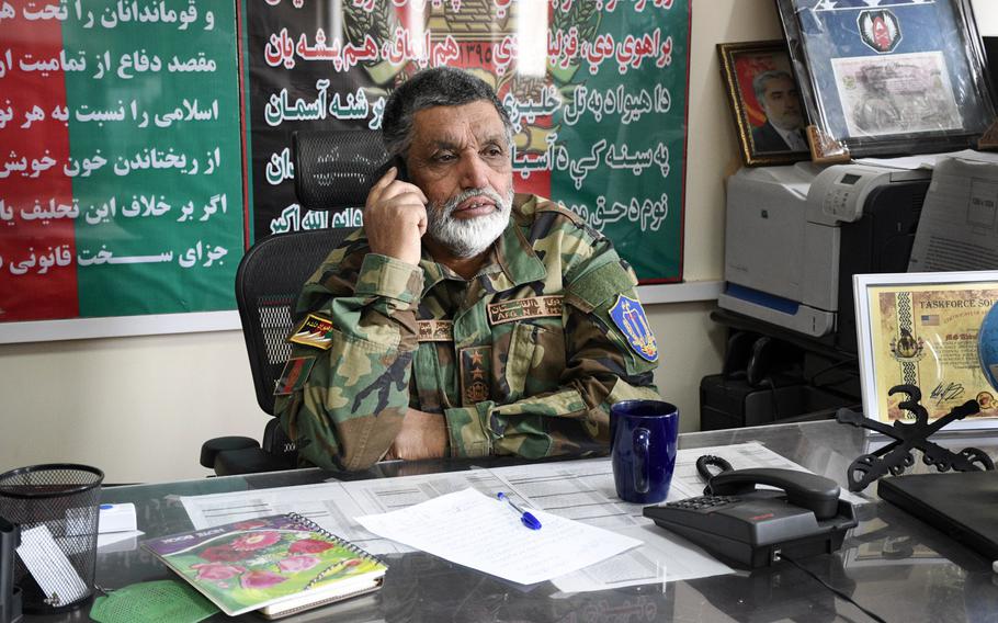 Brig. Gen. Abdul Raziq, then-commander of the Afghan army's 4th Brigade, 203rd Corps, answers calls prior to a meeting with American advisers on Jan. 14, 2019 at Camp Maiwand in Logar province, Afghanistan. U.S. Army Command Sgt. Maj. Timothy Bolyard was killed in an insider attack in September 2018 after meeting with Raziq at Camp Maiwand. 

