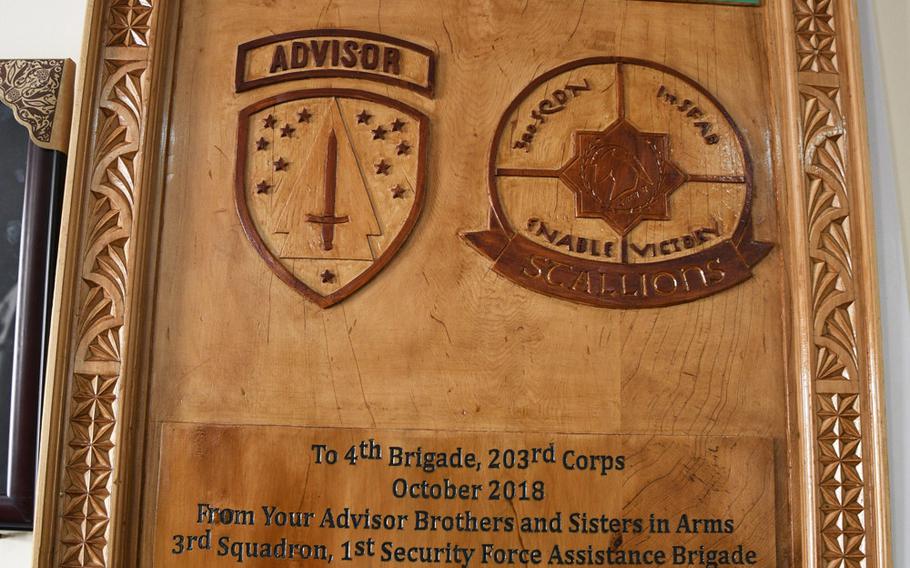 A plaque given to Brig. Gen. Abdul Raziq, then-commander of the Afghan army's 4th Brigade, 203rd Corps, by the 1st Security Force Assistance Brigade, hung in Camp Maiwand in Logar province south of Kabul, Afghanistan. U.S. Army Command Sgt. Maj. Timothy Bolyard was killed in an insider attack after a meeting with the general on Sept. 3, 2018.


