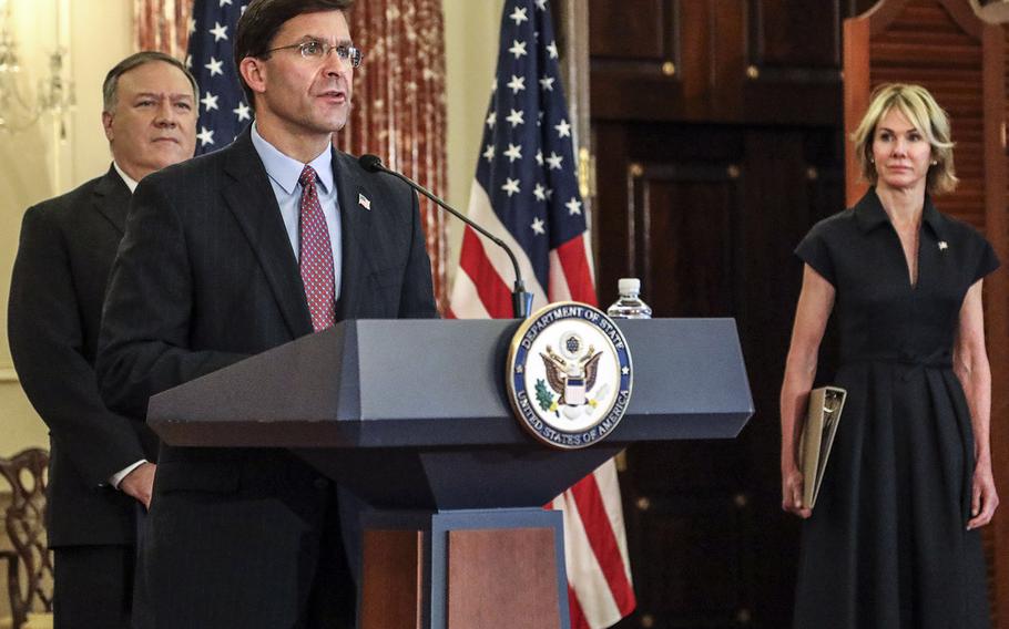Defense Secretary Mark Esper speaks Monday during a news briefing at the State Department on new Iranian sanctions. Behind him are Secretary of State Mike Pompeo and Ambassador to the United Nations Kelly Craft.