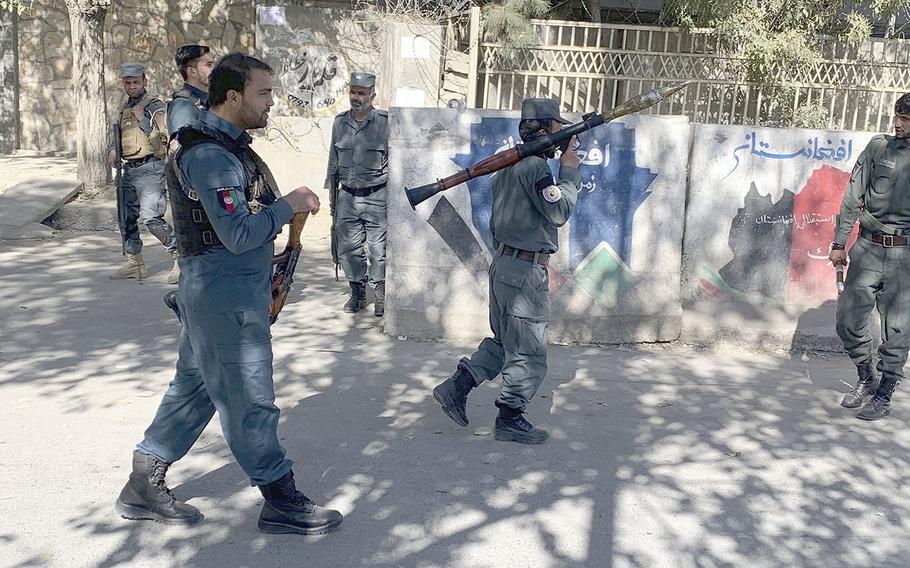 Afghan police arrive at the site of an attack at Kabul University in Kabul, Afghanistan, Monday, Nov. 2, 2020. Gunfire erupted at the university in the Afghan capital early Monday and police have surrounded the sprawling campus, authorities said. 
