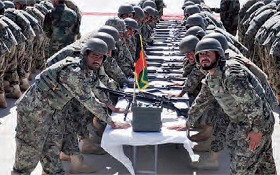 215th Corps soldiers of the Afghan National Army graduate from their training program in Helmand Province in in October 2020. 

