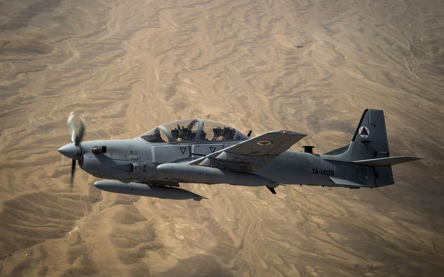 An Afghan air force A-29 Super Tucano soars over Afghanistan in 2015. The 81st Fighter Squadron at Moody Air Force Base, Ga., graduated its last class of Afghan A-29 Super Tucano student pilots Nov. 13, 2020. 

