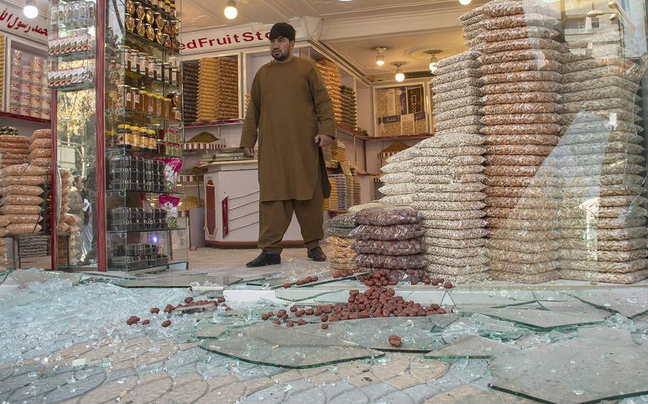 A man exits a shop damaged by rocket fire in Kabul's Shar-e-Now neighborhood on Saturday, Nov. 21, 2020. 

 