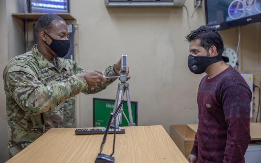 Army Staff Sgt. Dewayne Gordon, left, is pictured at Resolute Support headquarters in Kabul on Wednesday, Nov. 25, 2020. The father of three says the coronavirus pandemic has given everyone ''a little more perspective.''