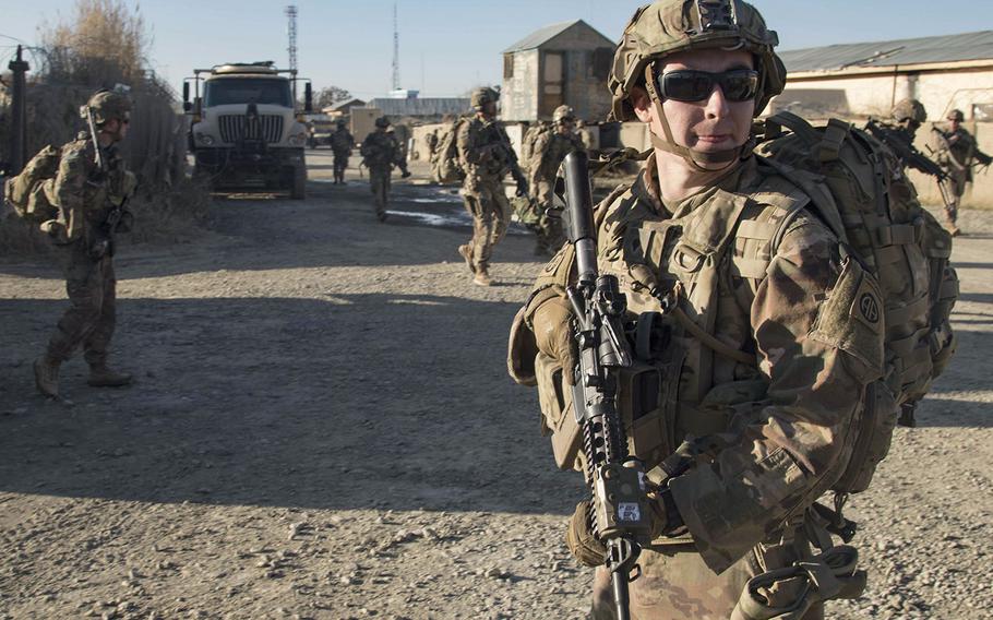 Paratroopers from the 82nd Airborne Division ensure the area is secure during a fly-to-advise mission in southeastern Afghanistan in December 2019. A measure has been included in the final version of the defense bill to prevent the further withdrawal of U.S. forces from Afghanistan without input from the Pentagon and other government agencies.