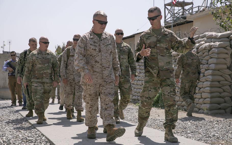 U.S. Army Brig. Gen. Donn H. Hill, front right, speaks with U.S. Marine Corps Gen. Kenneth F. McKenzie Jr., front left, the commander of U.S. Central Command, during McKenzieâ's visit in Jalalabad, Afghanistan, in September 2019.