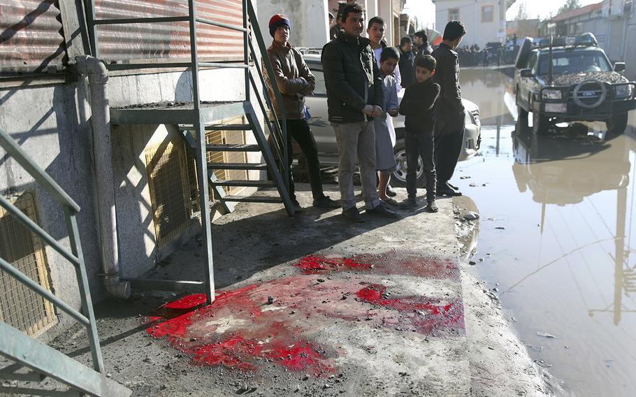 Blood stains are seen on the ground after a rocket in Kabul, Afghanistan, Saturday, Dec. 12, 2020. An early morning barrage slammed into the Afghan capital, an Interior Ministry spokesman said. 
