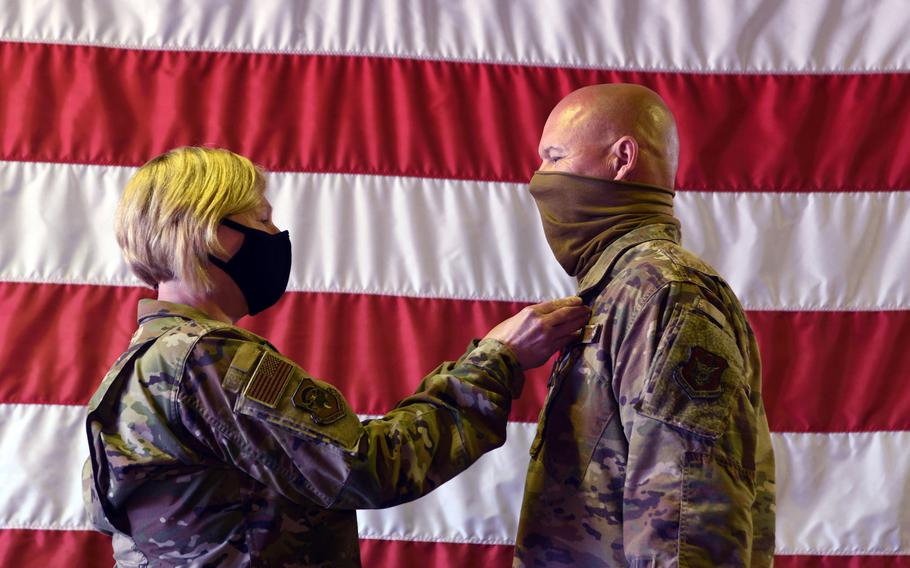 Col. Ann Brown, 459th Mission Support Group commander, pins the Bronze Star on Senior Master Sgt. Rick Johnson, 69th Aerial Port Squadron operations flight chief, during a ceremony Oct. 3rd, 2020, at Joint Base Andrews, Md. Johnson was recently awarded the Bronze Star and Air Force Commendation Medal for his heroic efforts and meritorious achievement while deployed in support of Operation Inherent Resolve.