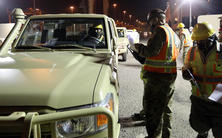 Vehicles are offloaded at Port of Shuaiba, Kuwait, Dec. 10, 2020, by U.S. Army personnel for eventual distribution to Iraqi Security Forces.