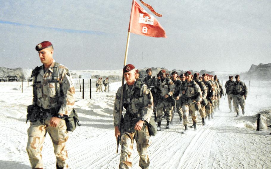 Soldiers with Bravo Company, 27th Engineer Battalion, march on Christmas Day, 1990 during Operation Desert Shield in Saudi Arabia. 

