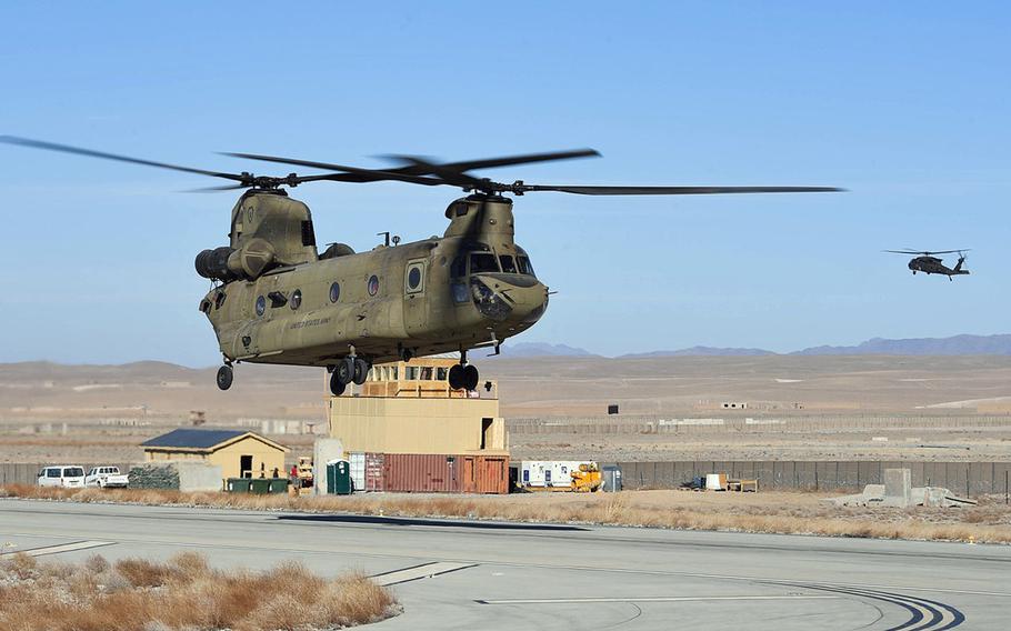 U.S. Army helicopters train at Camp Dahlke, Afghanistan, in December 2018. U.S. and NATO forces have left the base, formerly Forward Operating Base Shank, as the drawdown of U.S. troops in the country continues. Troop levels in Afghanistan are now at a 19-year low, President Donald Trump said in a statement on Jan. 14, 2021.

