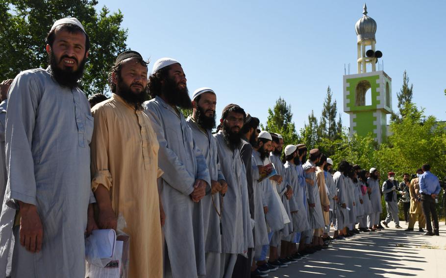 Taliban prisoners line up at Bagram prison before being released on May 26, 2020. Hundreds of Taliban prisoners released under the U.S.-Taliban peace deal have been rearrested after rejoining the insurgency, Afghanistan's national security advisor said. 

