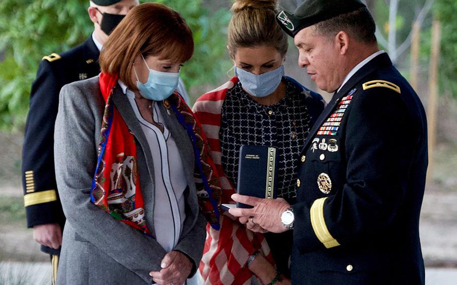 Maj. Gen. Miguel Correa, right, presents the Silver Star Medal to Staff Sgt. James ''Jimmy" Moriarty's mother, Cynthia Moriarty, left, and sister, Becky Moriarty Davis, center, in Houston on Wednesday, Jan. 27, 2021.


