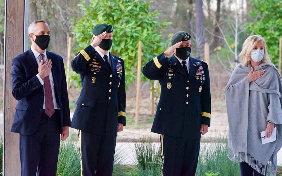 Special Forces Brig. Gen. Kevin Leahy and Maj. Gen. Miguel Correa, flanked by unidentified civilians, salute during a ceremony to present a posthumous Silver Star Medal to Staff Sgt. James ''Jimmy" Moriarty's family in Houston on Wednesday, Jan. 27, 2021.

