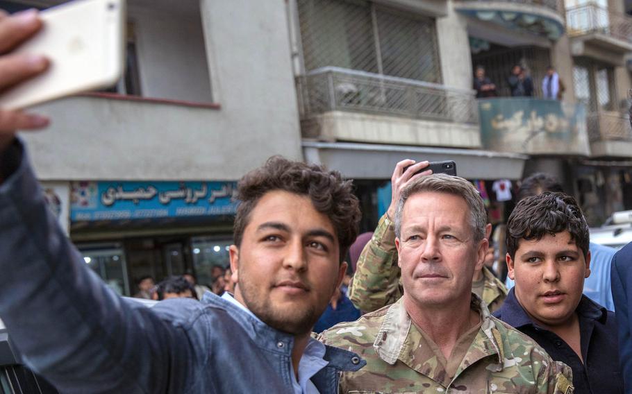 Resolute Support commander Gen. Scott Miller poses for a selfie with a resident in downtown Kabul, Afghanistan, Feb. 26, 2020. Miller, on March 5, 2021, became the longest-serving commander of American and NATO forces in Afghanistan.