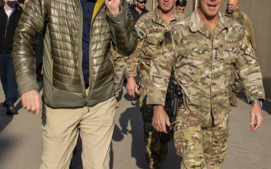 Then-acting Defense Secretary Christopher Miller, left, walks with Gen. Scott Miller in Kabul, Afghanistan, Dec. 22, 2020. Gen. Miller became the longest-serving commander of American and NATO forces in Afghanistan on March 5, 2021.
