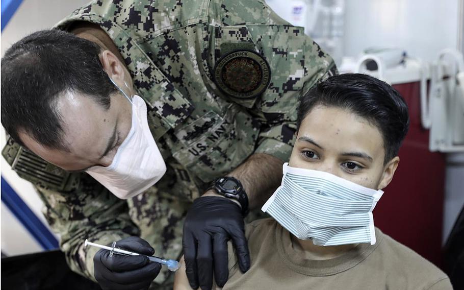 Petty Officer 3rd Class Diana Elston, with the Navy's expeditionary medical unit, receives the coronavirus vaccine at Erbil Air Base, Iraq. in January 2021. 


