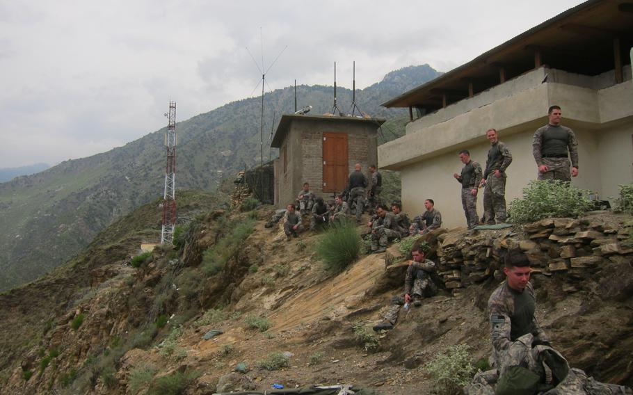 U.S. soldiers watch from an observation post in the Pech Valley in Afghanistan in 2010.