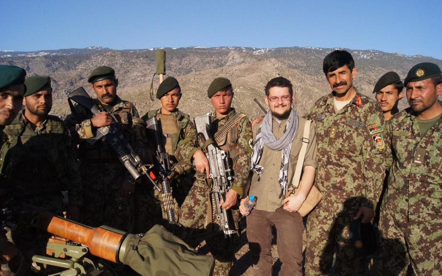 Wesley Morgan, author of the ''The Hardest Place: The American Military Adrift in Afghanistan's Pech Valley,'' stands with Afghan soldiers in the Pech Valley in 2013.
