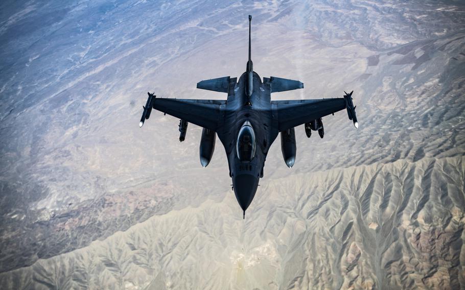 A U.S. Air Force F-16C Fighting Falcon flies over Afghanistan in 2018. The U.S. conducted airstrikes against Taliban fighters in southern Afghanistan this week after the insurgents launched multiple attacks on Afghan government forces, a U.S. military spokesman said March 17, 2021. 

