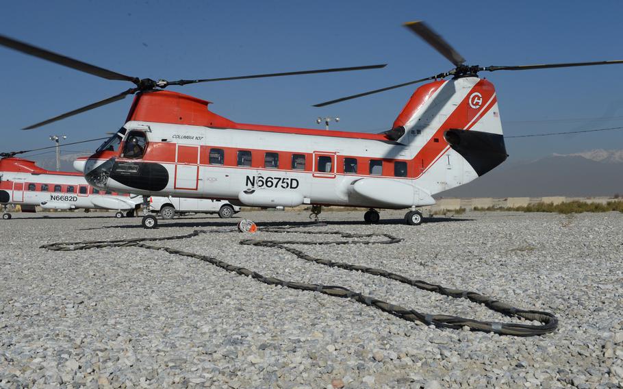 A V-107 helicopter waits to move cargo from Bagram Airfield, Afghanistan, in December 2016. An error by the U.S. military meant some coalition partners, who are supposed to pay back the cost of helicopter transportation, got free rides for three years, says a March 22, 2021, report by the Defense Department Inspector General.