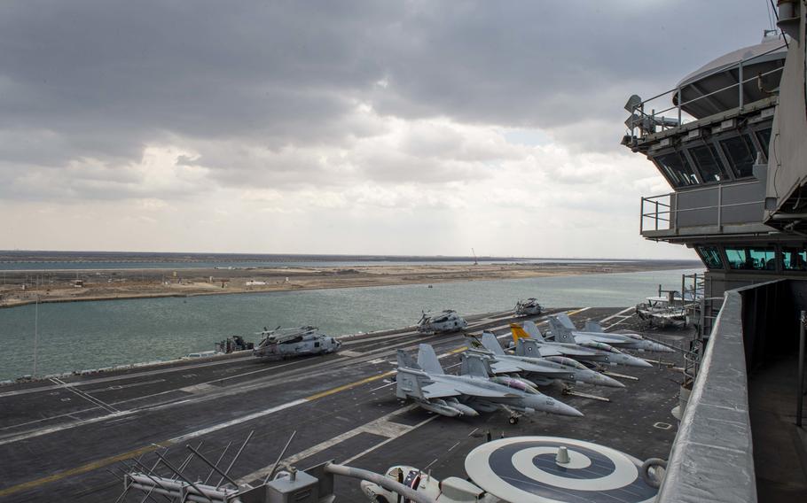 The aircraft carrier USS Dwight D. Eisenhower transits the Suez Canal, April 2, 2021. The canal was blocked for six days when a commercial ship ran aground last month.   
