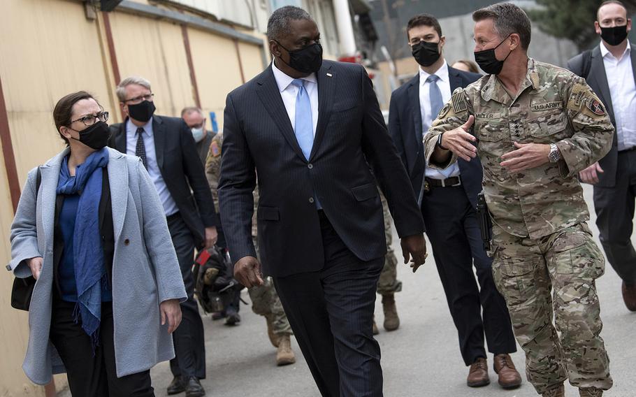 Defense Secretary Lloyd Austin walks with the commander of NATO’s Resolute Support Mission and U.S. Forces – Afghanistan, Army Gen. Scott Miller, at Resolute Support Headquarters, Kabul, Afghanistan, on March 21, 2021.