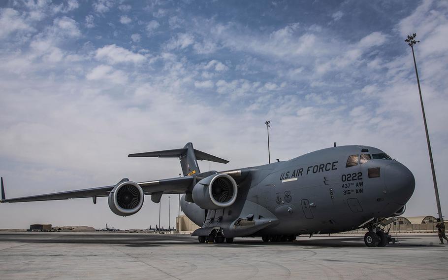 In an April 27, 2021 photo, a C-17 Globemaster III assigned to Joint Base Charleston, S.C., parks on the flight line at Al Udeid Air Base, Qatar. C-17s and other mobility aircraft around the U.S. Air Forces Central theater are assisting with the safe and orderly drawdown operations from Afghanistan.