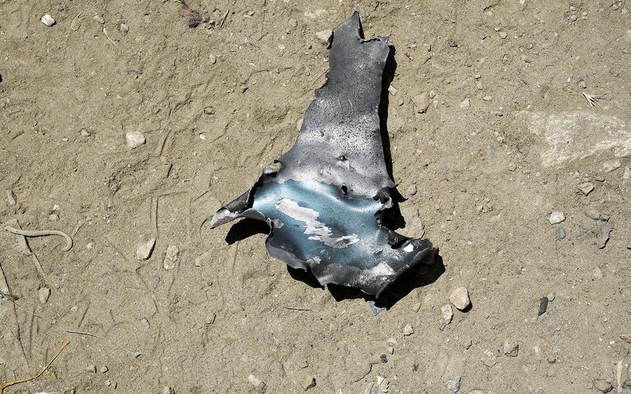 A piece of shrapnel left after a vehicle bomb blew up near a school in west Kabul, Afghanistan on Saturday, May 8, 2021. The attack left at least 50 dead and more than 100 wounded, a statement by the Afghan Interior Ministry said on Sunday, May 9, 2021.