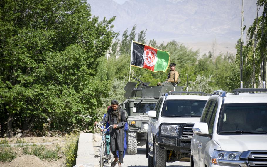 A convoy belonging to Abdul Qayum Rahimi, governor of the province of Logar in Afghanistan, travels through Taliban-contested territory during a cease-fire May 14, 2021. Logar residents are pessimistic about the prospect of peace in the country as U.S. and coalition troops withdraw. 