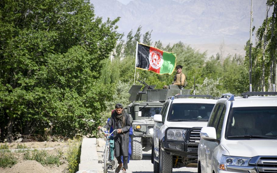 A convoy belonging to Abdul Qayum Rahimi, governor of the province of Logar in Afghanistan, travels through Taliban-contested territory during a cease-fire May 14, 2021. Logar residents are pessimistic about the prospect of peace in the country as U.S. and coalition troops withdraw.