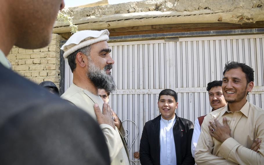 Abdul Qayum Rahimi, governor of the province of Logar in Afghanistan, meets with residents of a village in a Taliban-contested area during a cease-fire May 14, 2021. Rahimi said it was important to show that the government was willing to meet with people, even members of the Taliban. 