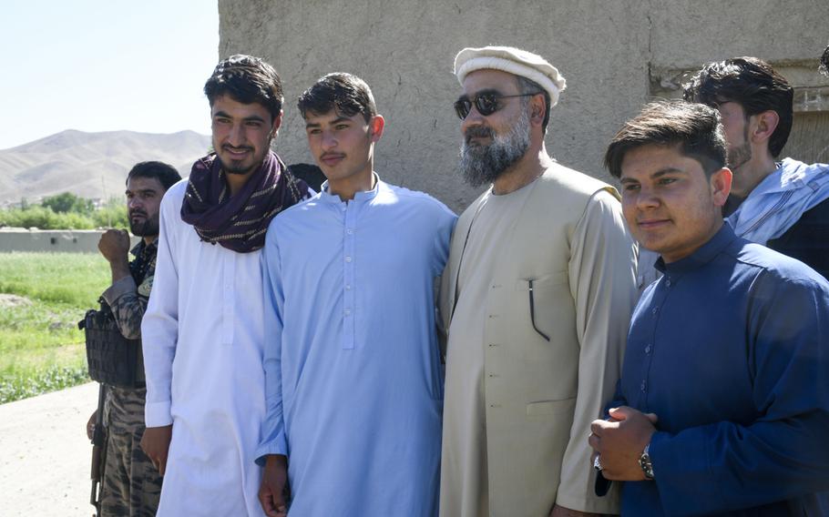 Abdul Qayum Rahimi, governor of the province of Logar in Afghanistan, meets with residents of a Taliban-contested village during a cease-fire May 14, 2021.