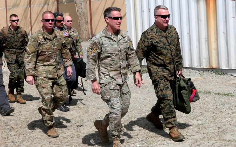 U.S. Marine Corps Gen. Kenneth F. McKenzie Jr., front right, head of U.S. Central Command, meets with Gen. Scott Miller, front left, Resolute Support mission commander, during his visit to Kabul, Afghanistan, April, 5, 2019. Miller became the longest-serving commander of American and NATO forces in Afghanistan on March 5, 2021.