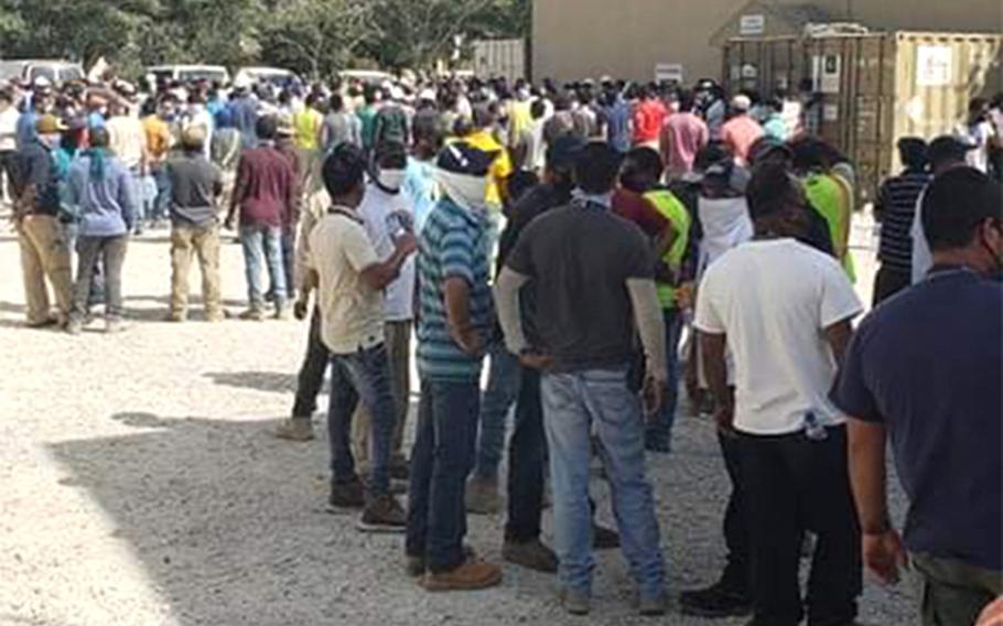 Employees working for the U.S.-based Fluor Corporation at Bagram Airfield in Afghanistan demonstrate outside the company’s HR office on base on July 12, 2020. The workers, mainly from Africa and Asia, say Fluor's pays them less than workers from the U.S. or Europe.

