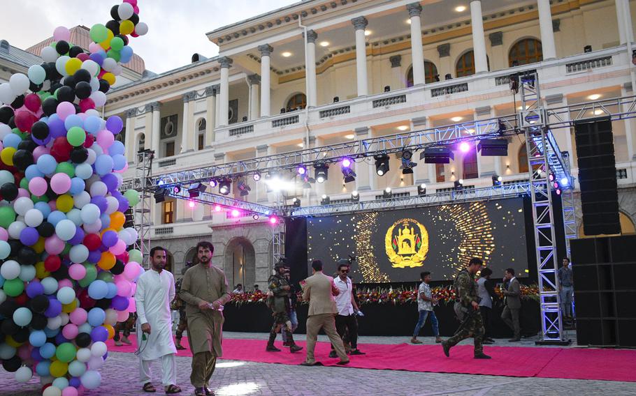 Afghans arrive at Darul Aman Palace to attend a celebration of Afghanistan’s Independence Day in Kabul on Aug. 18, 2020. The palace was restored last year after being ravaged by war.

