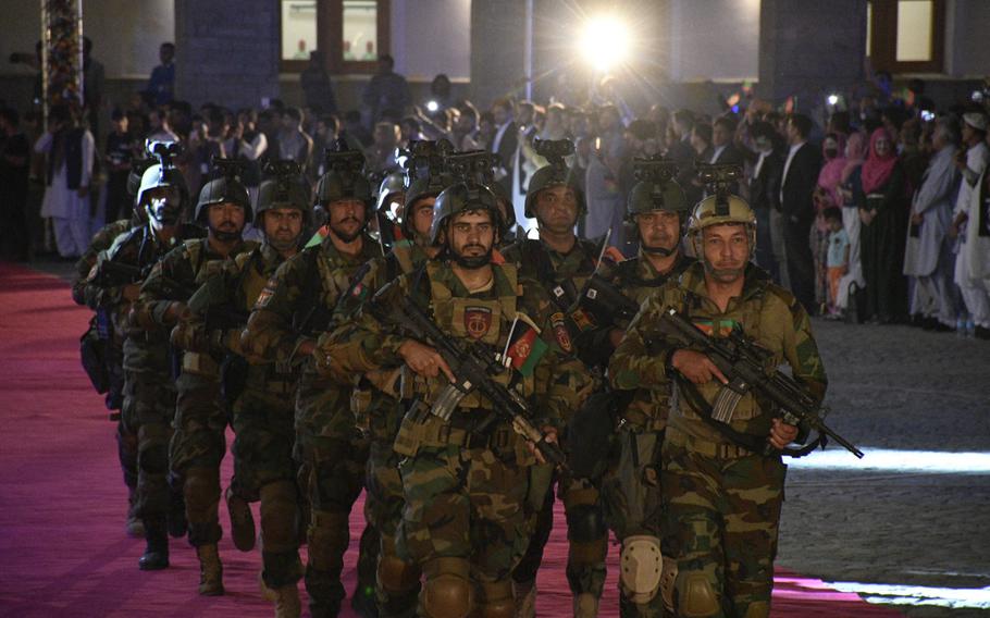 Afghan National Army soldiers parade at the restored Darul Aman Palace for a crowd celebrating Afghanistan’s Independence Day in Kabul on Aug. 18, 2020. 

