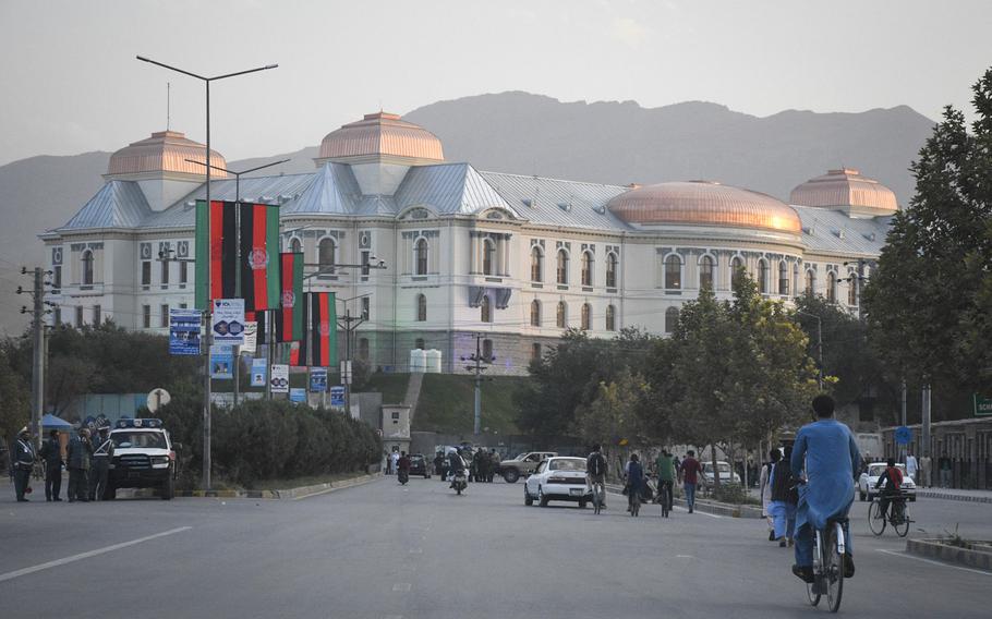 Afghans bike and drive past Darul Aman Palace in Kabul, Afghanistan prior to a celebration of the country’s Independence Day on Aug. 18, 2020. The palace, once ravaged by years of war, has been restored and rehabilitated.  

