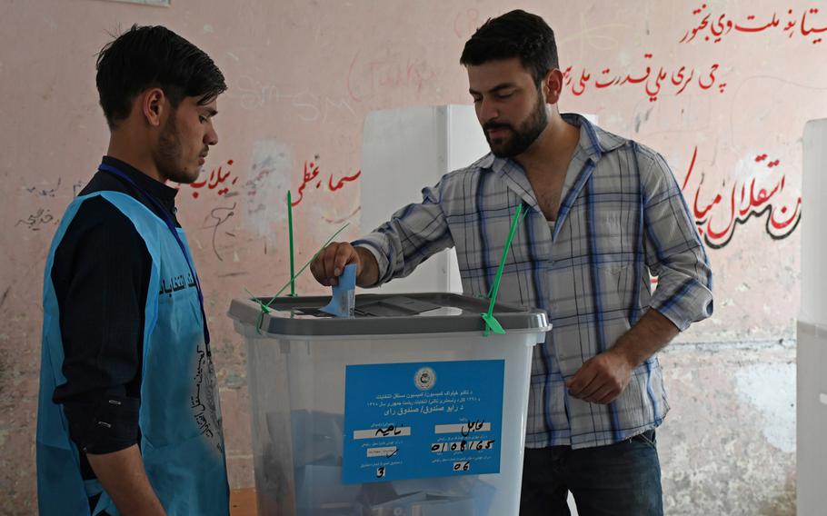 A man casts his ballot in Afghanistan's presidential election on Saturday, Sept. 28, 2019. 